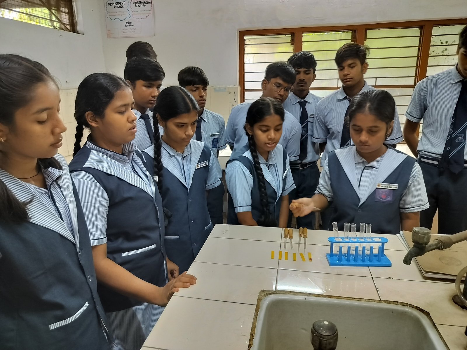 RGHSS students carrying out an experiment in the chemistry laboratory
